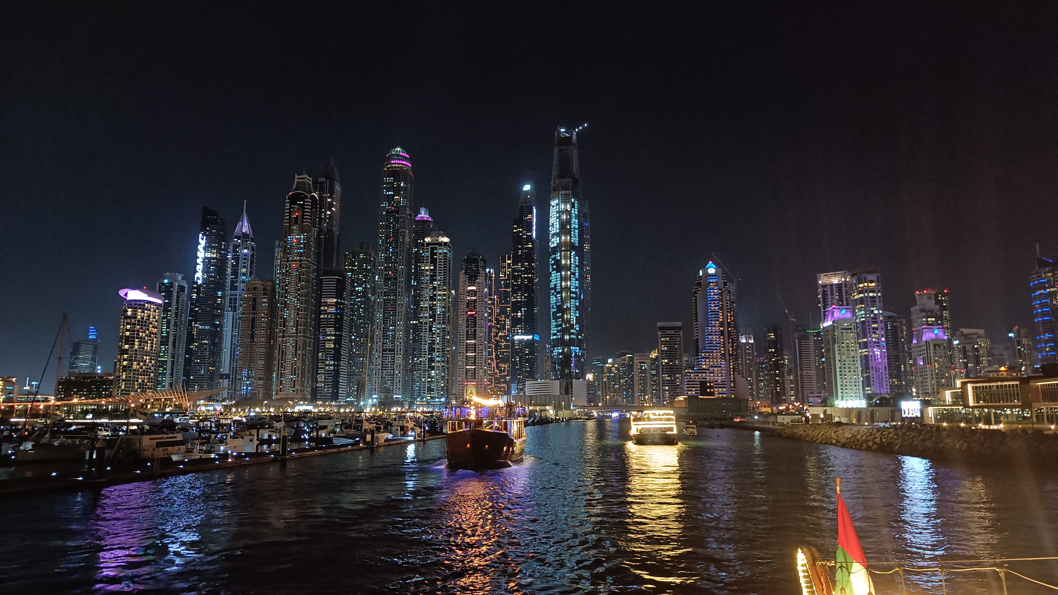 Dhow Cruise dinner setting with entertainment - authentic Arabian dining experience on water