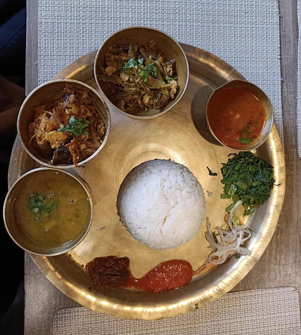Traditional Sikkimese cuisine at Nimtho restaurant with mountain views