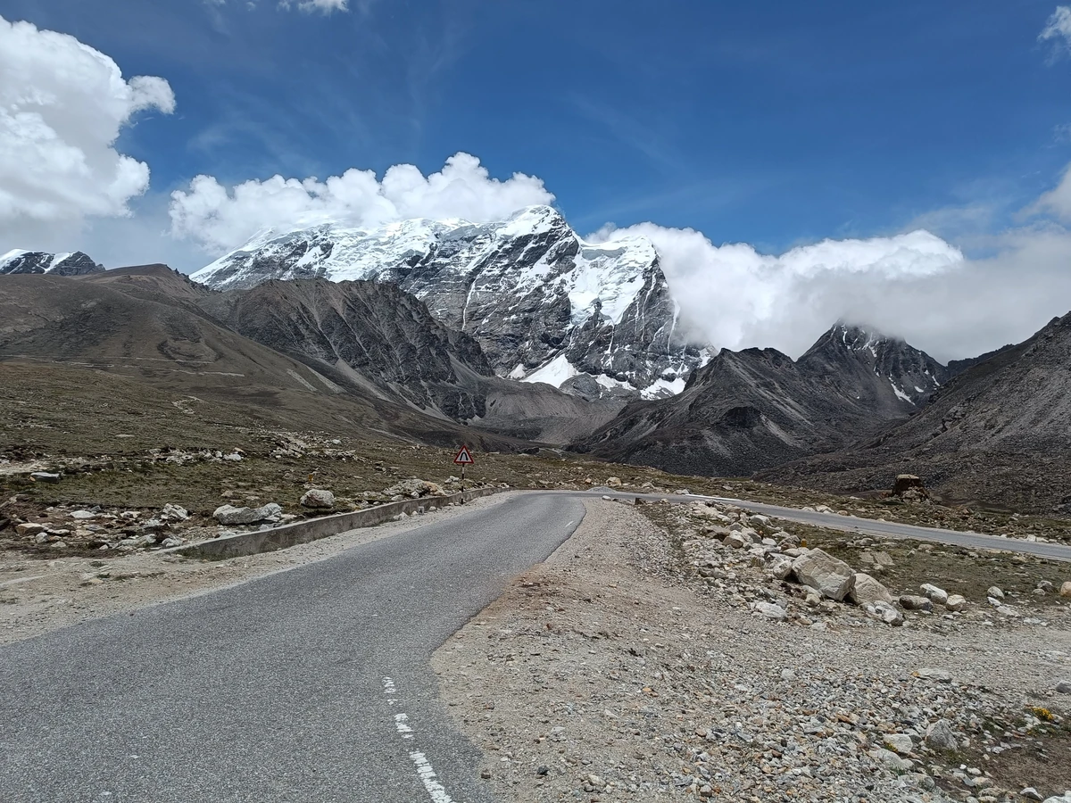 Mountain path leading to Gurudongmar Lake through the Himalayan landscape