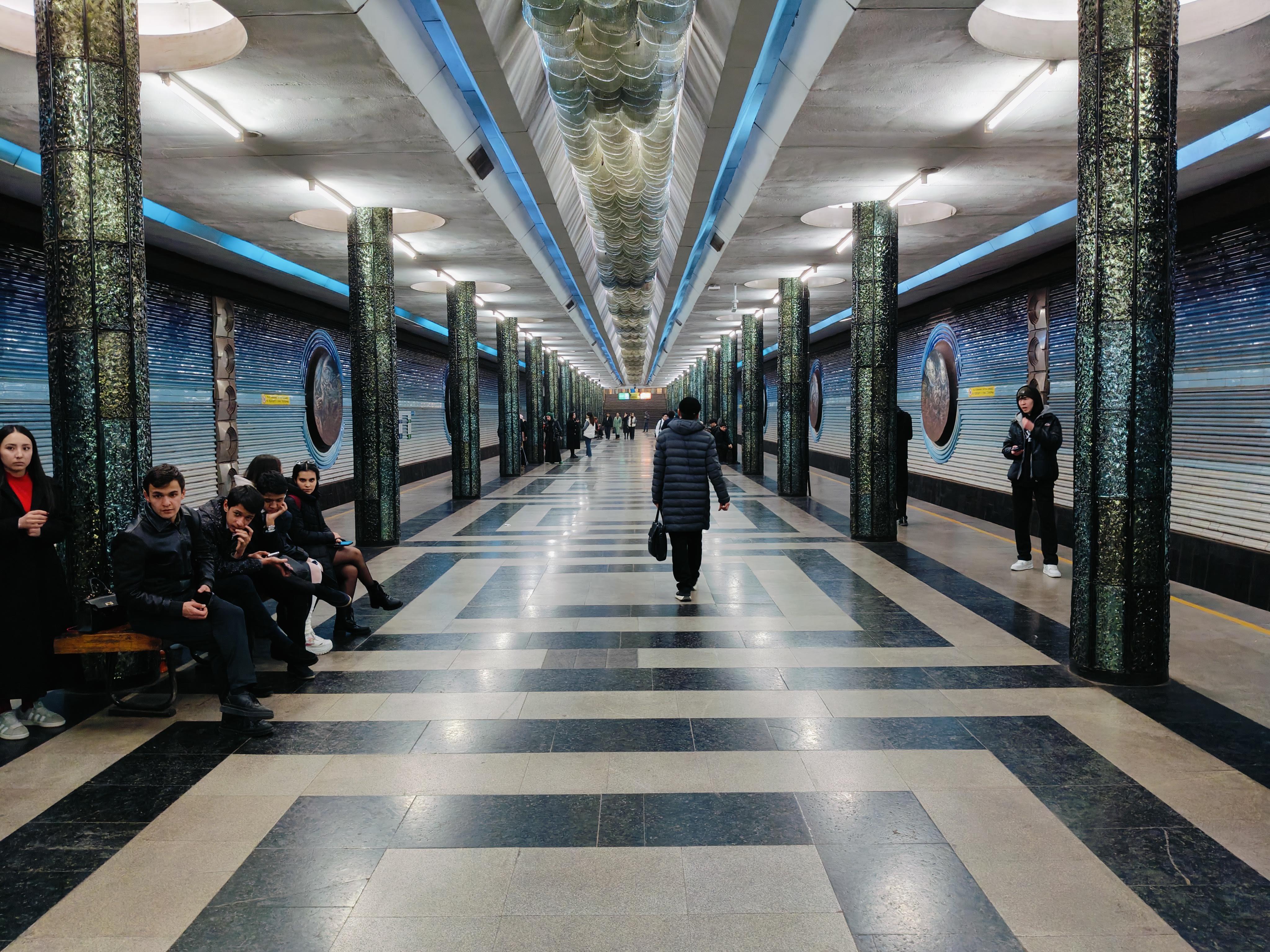 Futuristic space-themed Kosmonovtlar Metro Station in Tashkent - architectural masterpiece featuring portraits of Soviet cosmonauts and celestial motifs in one of world's most beautiful subway systems