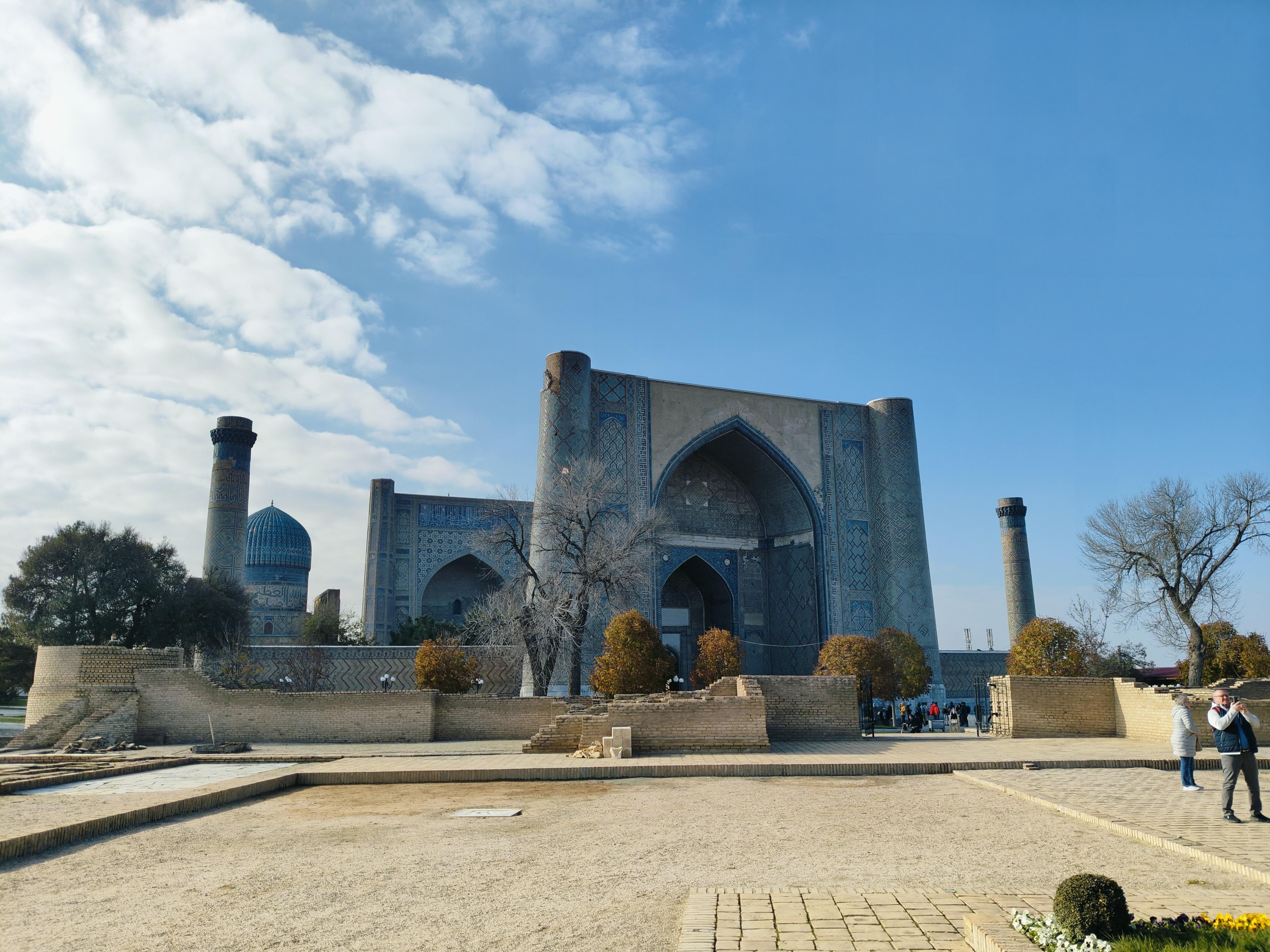 Historic 600-year-old Bibi-Khanum Mosque in Samarkand, Uzbekistan with massive blue dome and ornate Islamic architecture