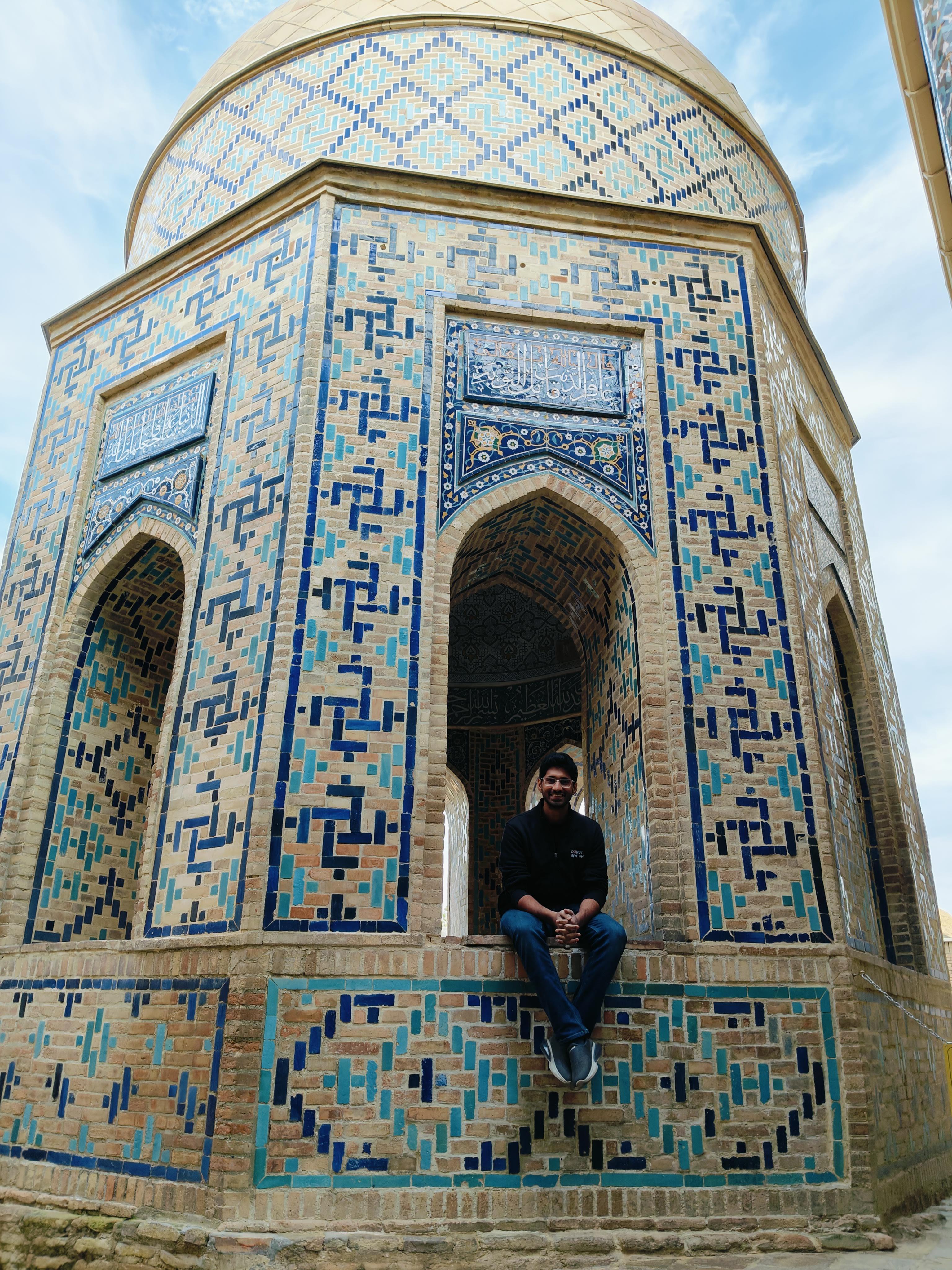 Exquisite tiled mausoleum with intricate blue geometric patterns in Shah-i-Zinda necropolis, Samarkand - masterpiece of medieval Islamic architecture