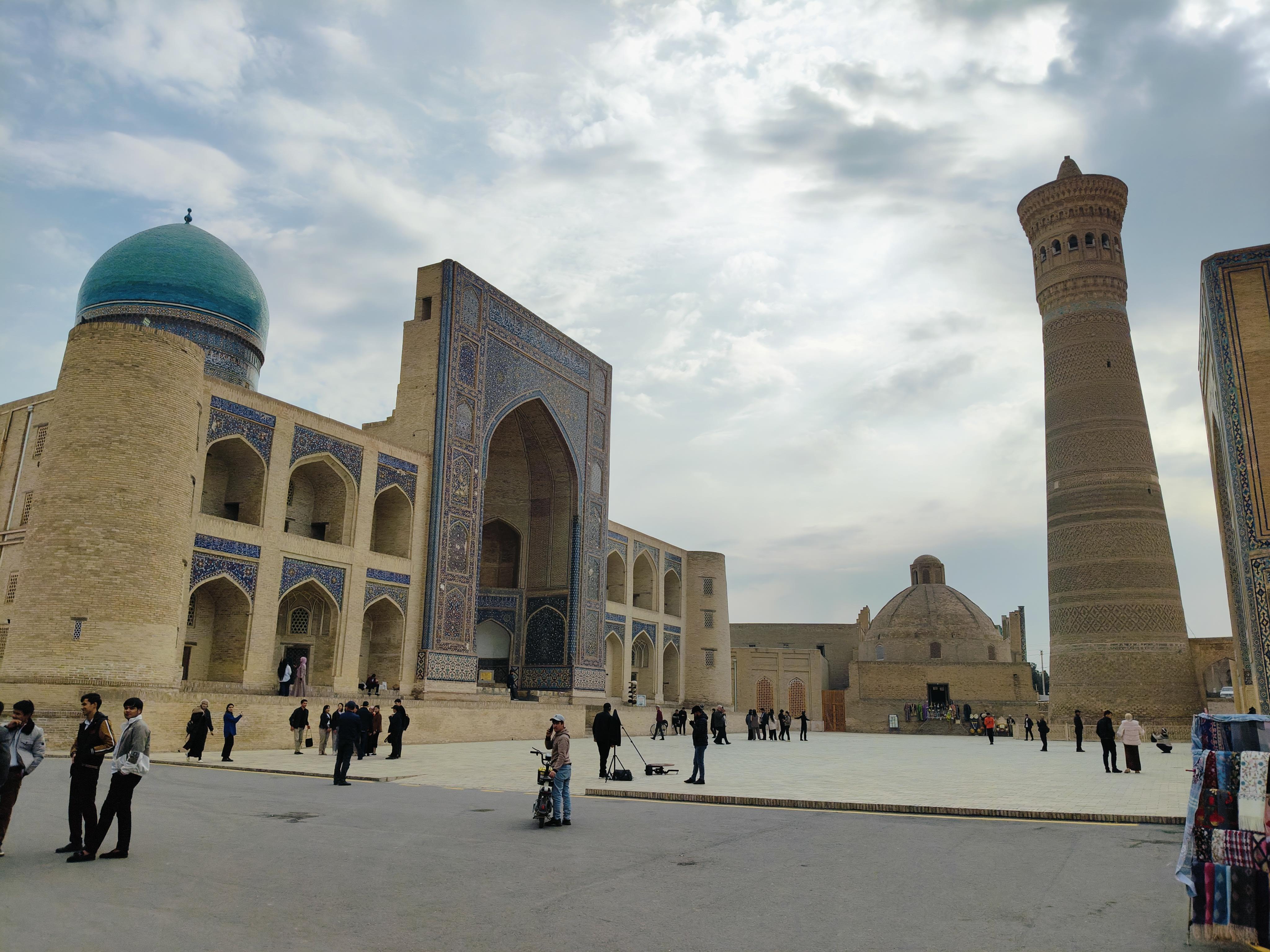Historic Kalon Square in Bukhara with the iconic 12th-century Kalon Minaret and Mir Arab Madrasa - centerpiece of Bukhara's architectural ensemble
