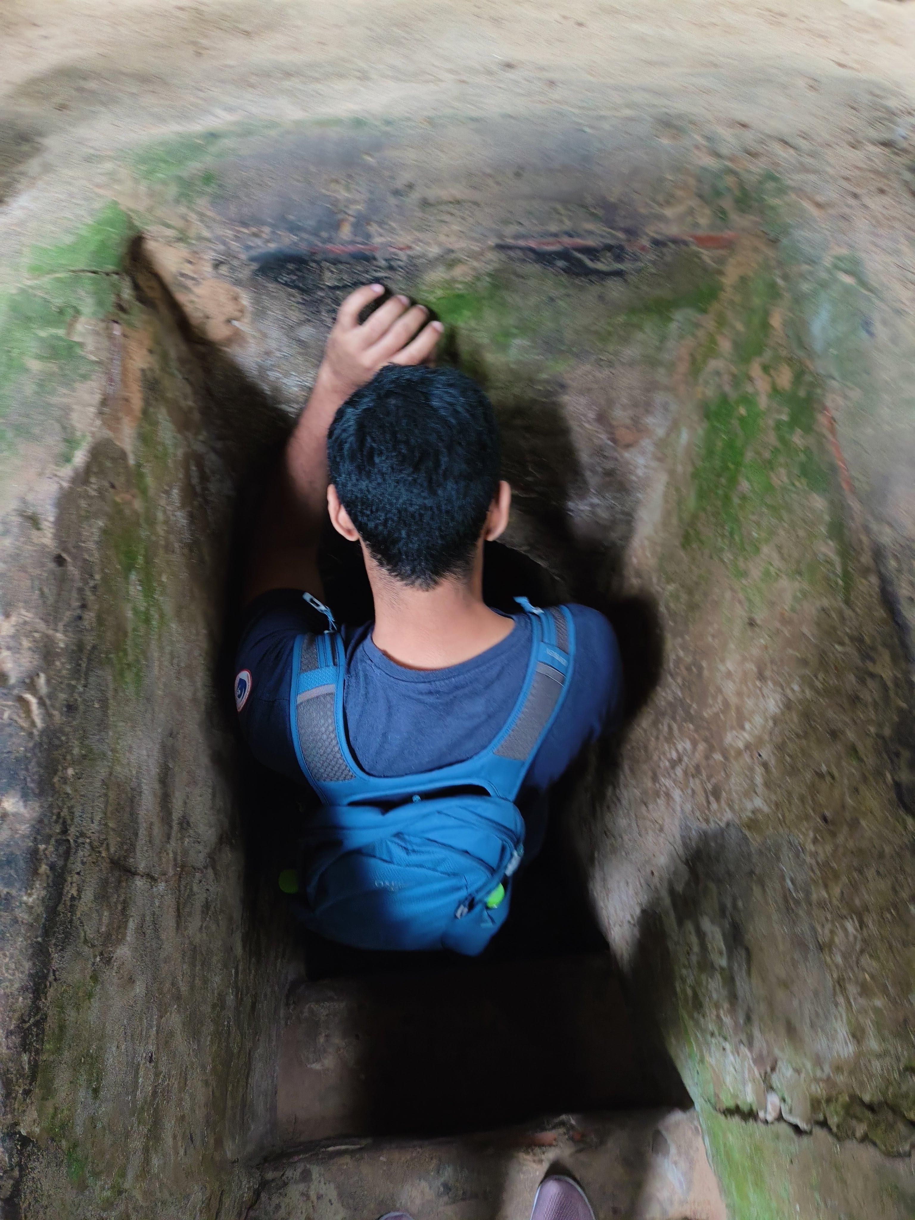 Hidden entrance to Cu Chi Tunnels system showing ingenious camouflage techniques used during Vietnam War