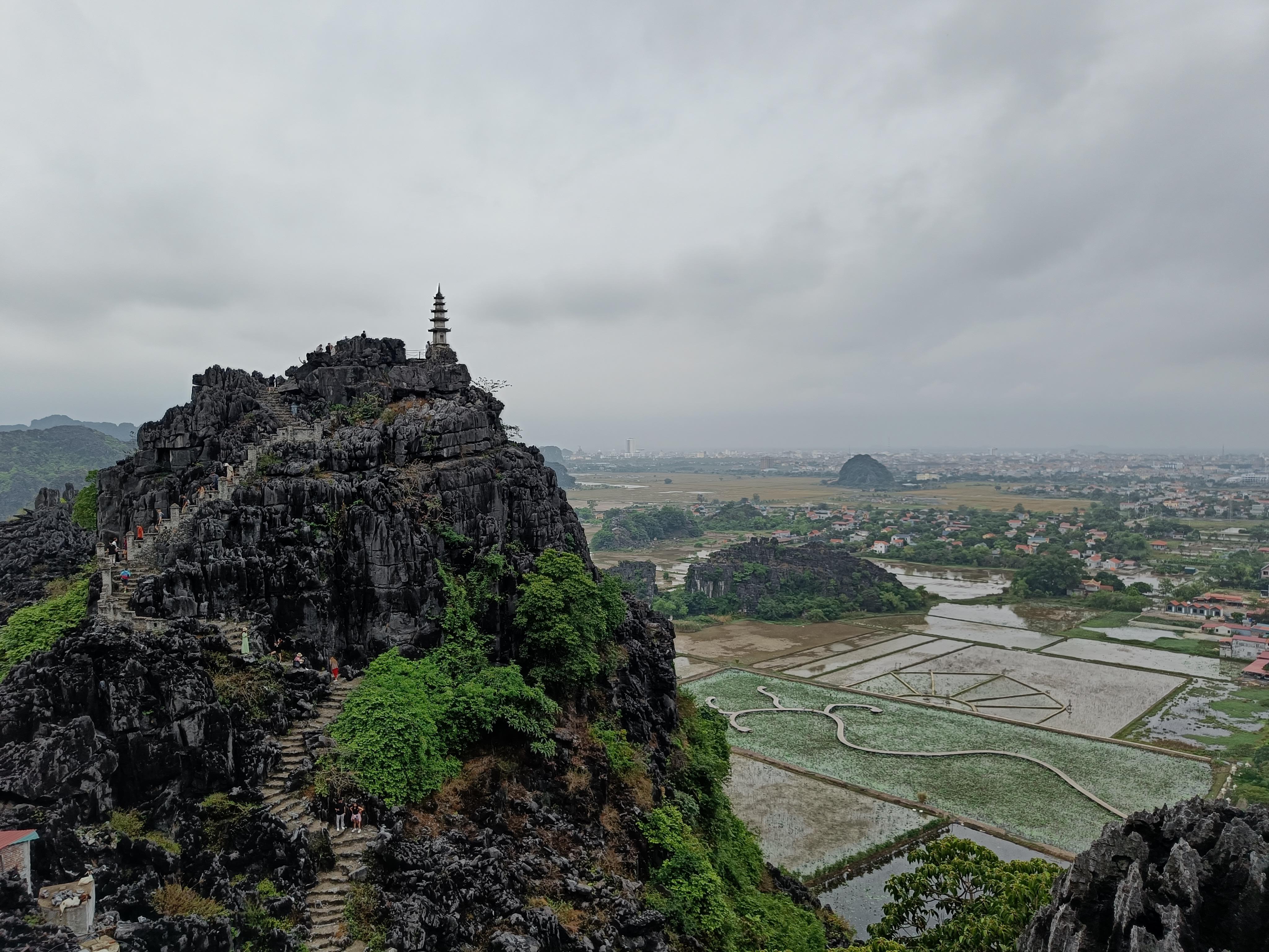 Spectacular natural scenery of Ninh Binh Vietnam with mountains, waterways and traditional boats