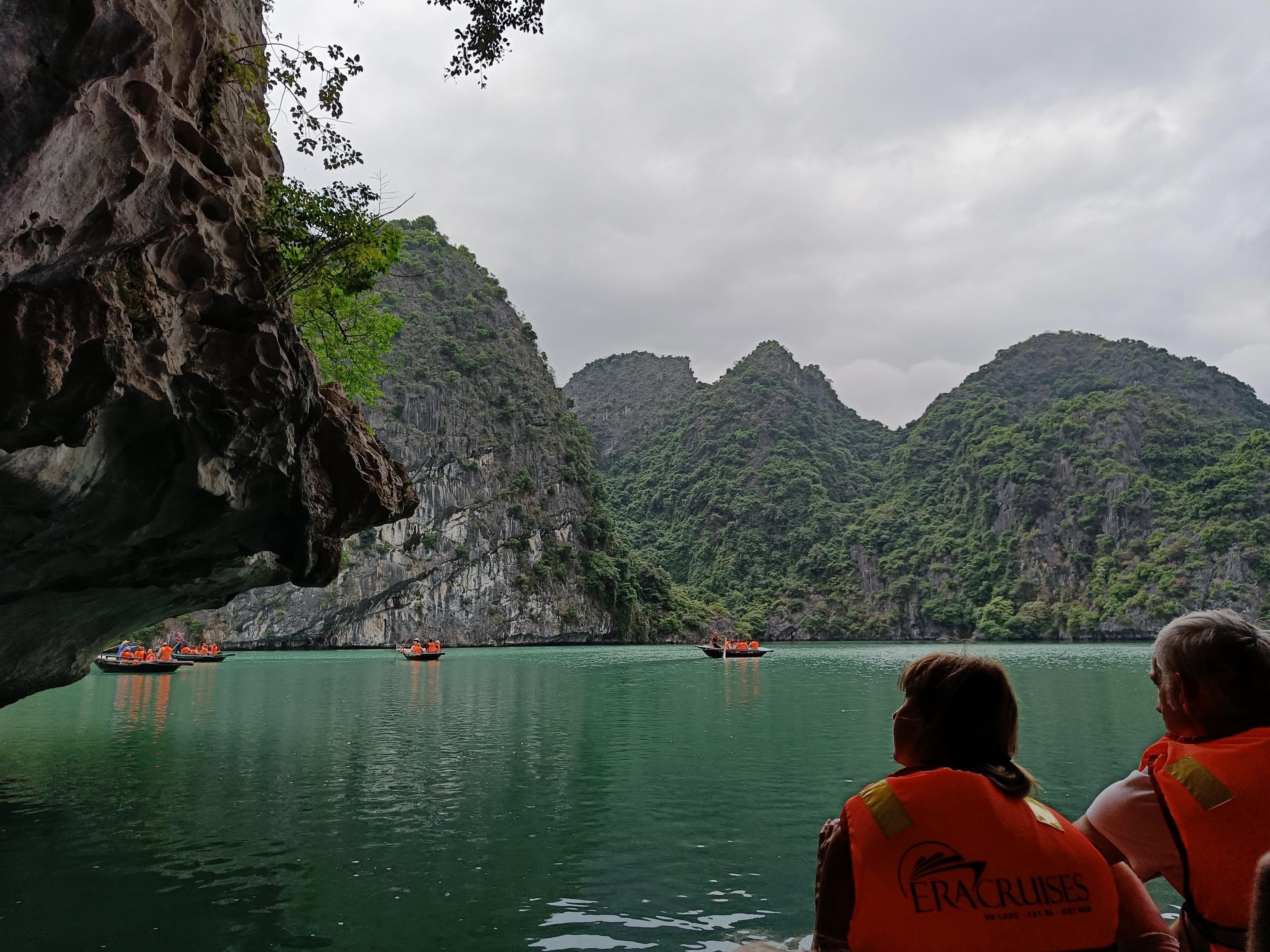 Tourists enjoying various water activities and excursions in the pristine waters of Ha Long Bay Vietnam